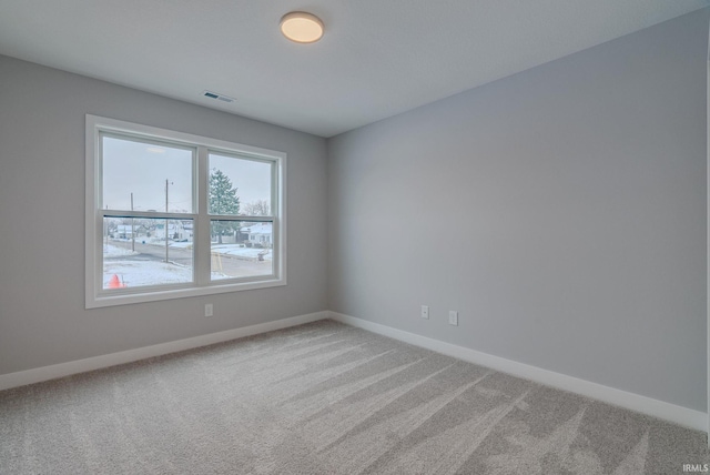 spare room with carpet floors