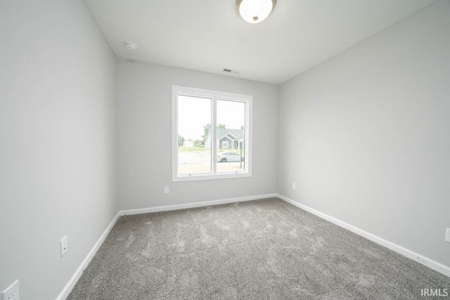 unfurnished room with carpet floors