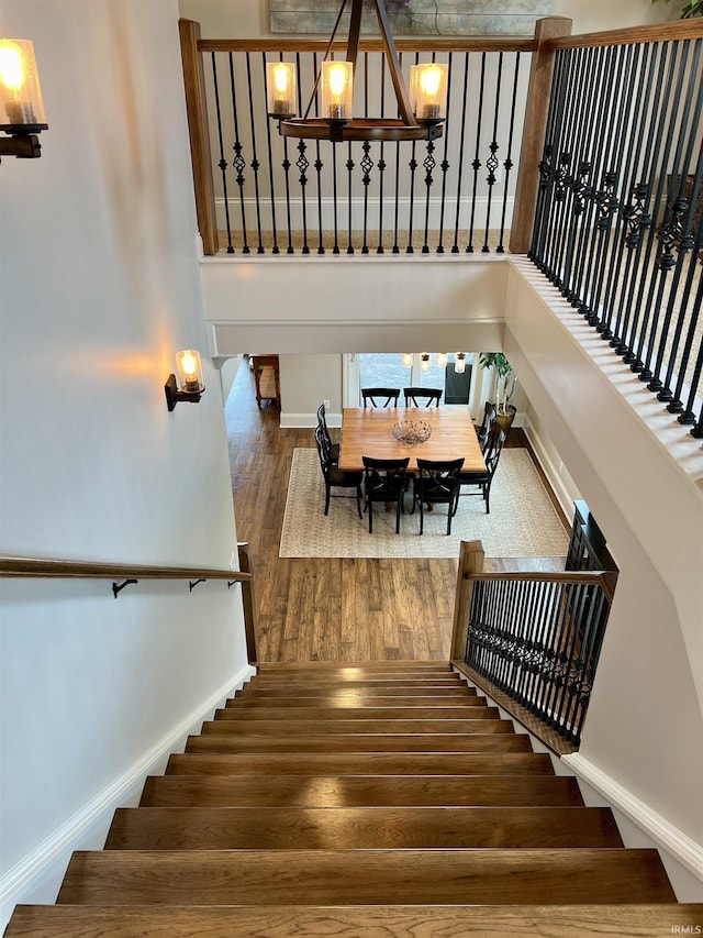 stairs with hardwood / wood-style flooring