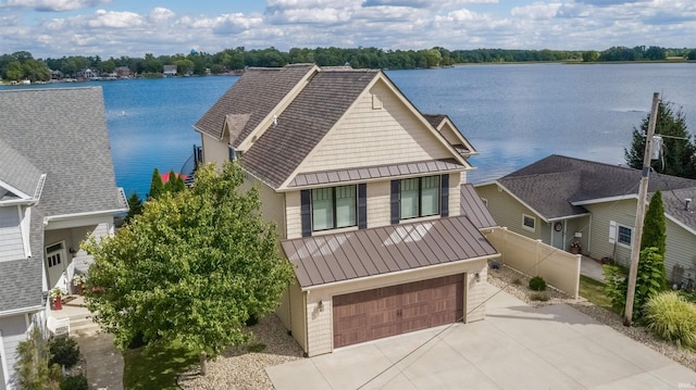 view of front of property featuring a water view and a garage