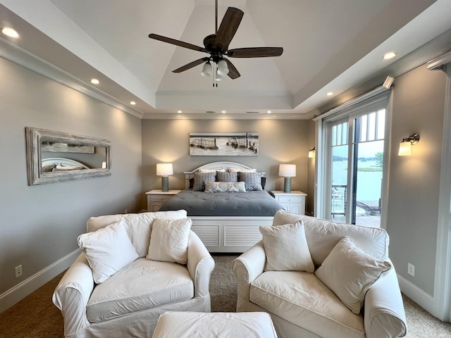 carpeted bedroom with a tray ceiling, ceiling fan, lofted ceiling, and access to outside