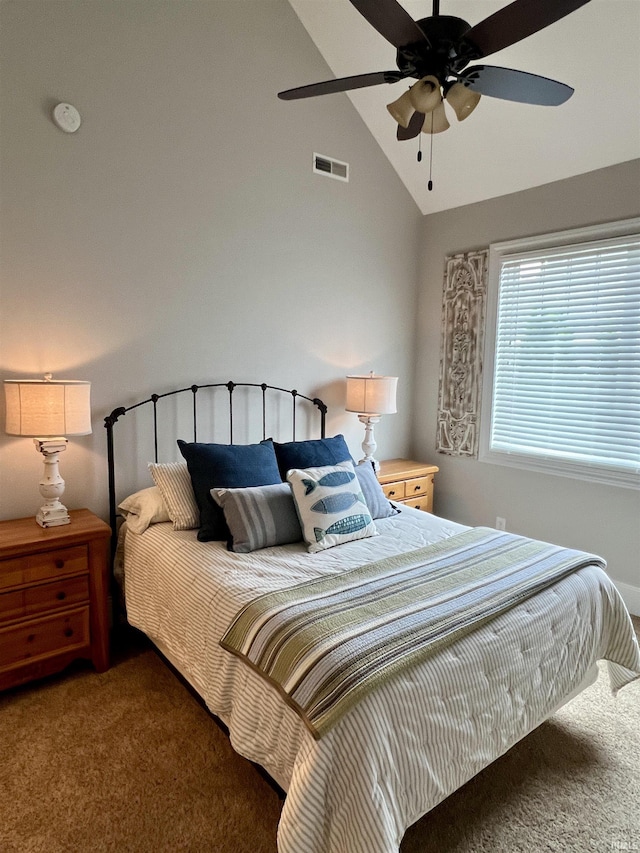 carpeted bedroom featuring ceiling fan and vaulted ceiling