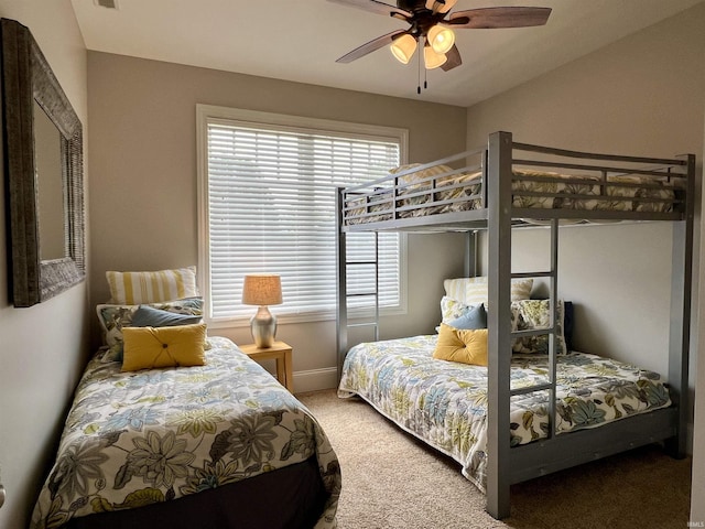 bedroom featuring ceiling fan and carpet floors