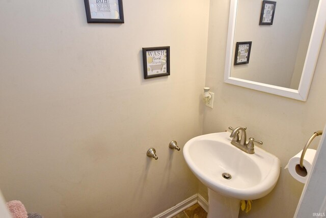 bathroom with sink and tile patterned flooring