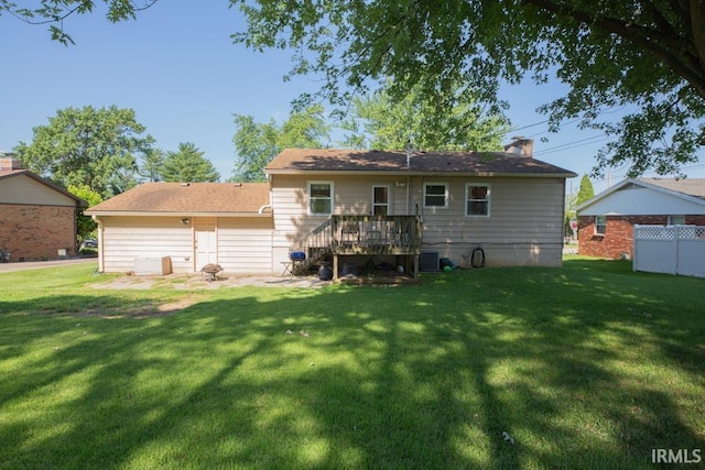 back of house with a yard