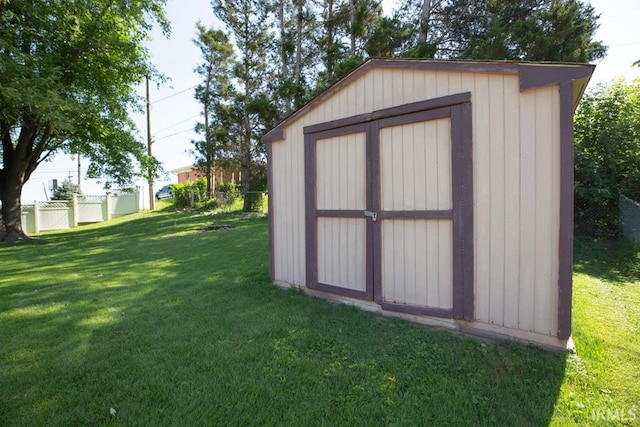 view of outbuilding featuring a lawn