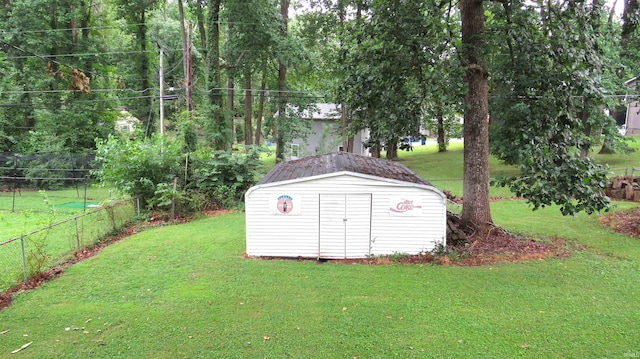 view of outdoor structure featuring a lawn