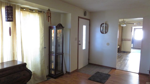 entryway featuring hardwood / wood-style flooring and ceiling fan