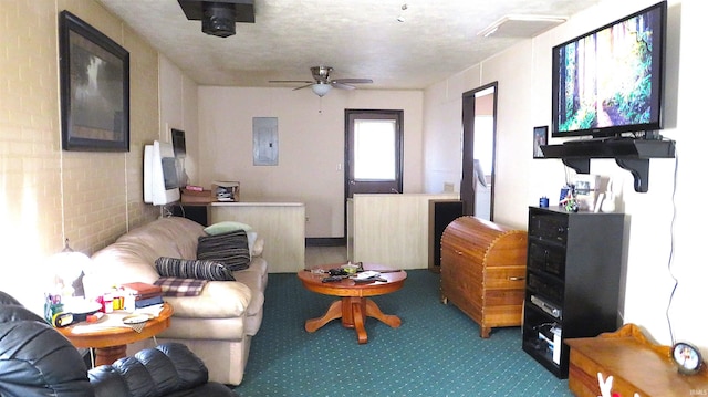 living room with a textured ceiling, electric panel, and ceiling fan