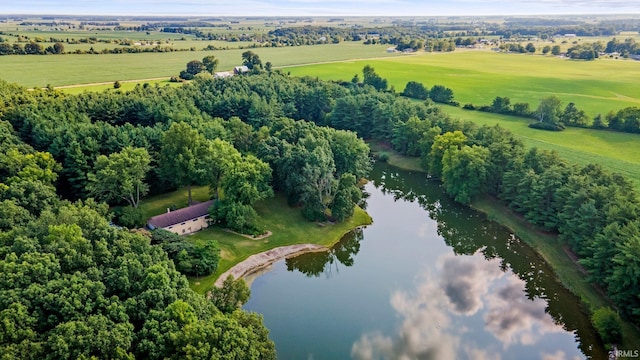 birds eye view of property featuring a rural view and a water view