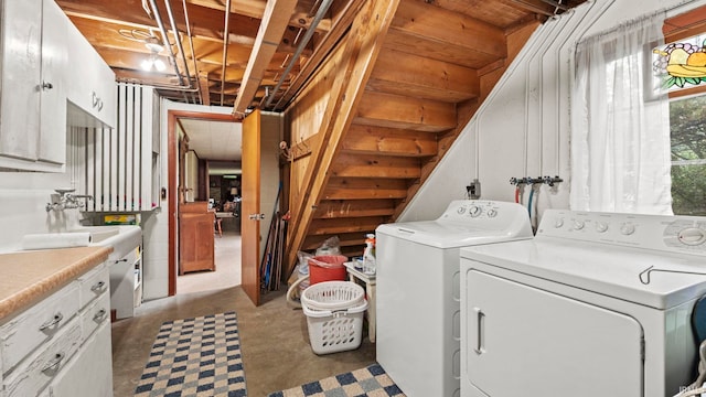 laundry area with cabinets and washing machine and clothes dryer