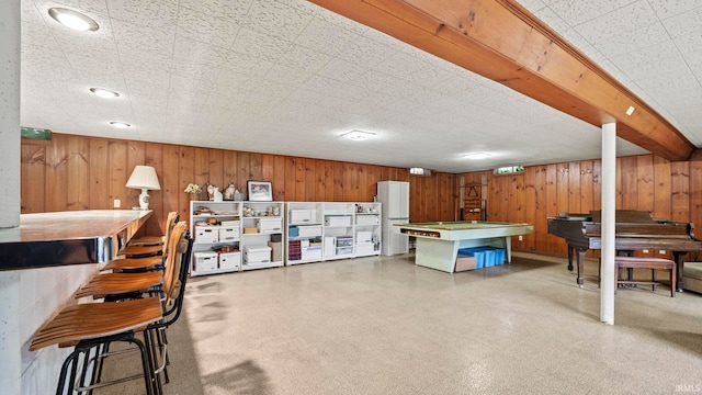 playroom with wooden walls and billiards