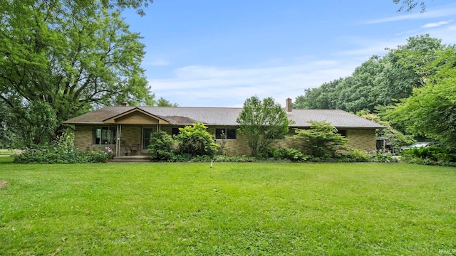 ranch-style house with a front lawn