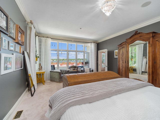 bedroom featuring a chandelier, light colored carpet, ornamental molding, and multiple windows