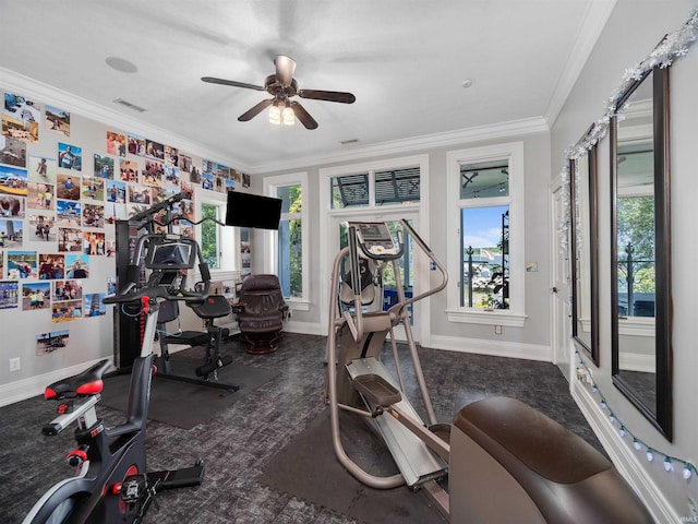 exercise room featuring ceiling fan and crown molding