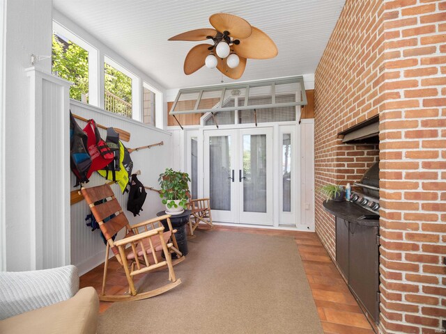 interior space with french doors and ceiling fan