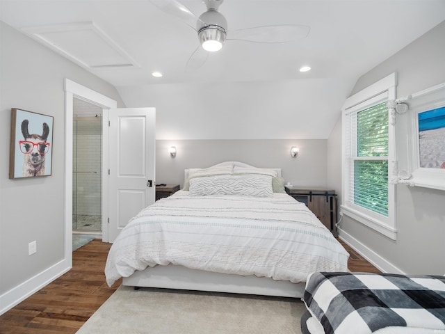 bedroom featuring ceiling fan, radiator heating unit, dark wood-type flooring, and vaulted ceiling