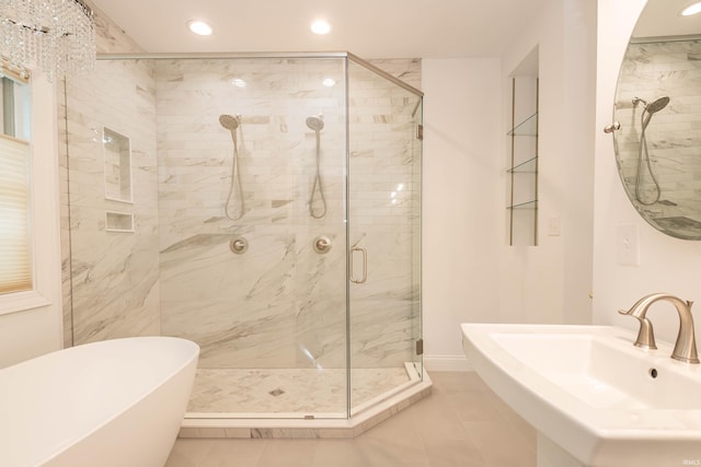 bathroom featuring plus walk in shower and tile patterned flooring