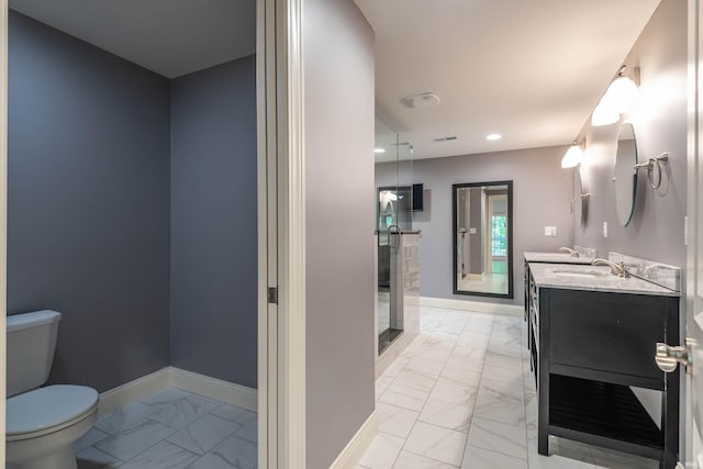 bathroom featuring a shower with door, tile patterned flooring, toilet, and double sink vanity