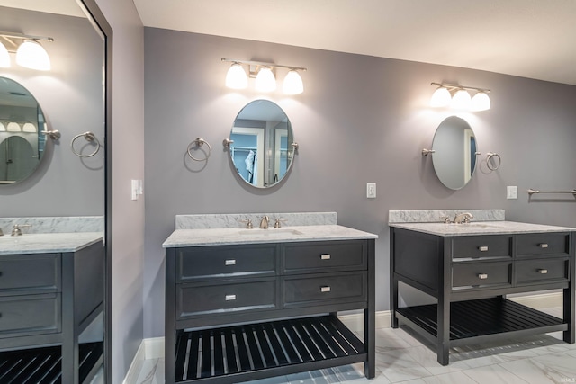 bathroom with tile patterned floors and double sink vanity