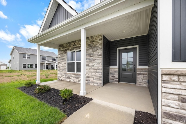 view of exterior entry with a porch