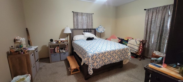 bedroom featuring light colored carpet