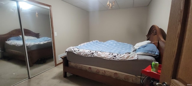 carpeted bedroom featuring a closet