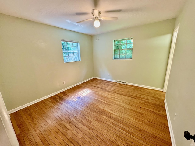 unfurnished room featuring ceiling fan and light hardwood / wood-style flooring