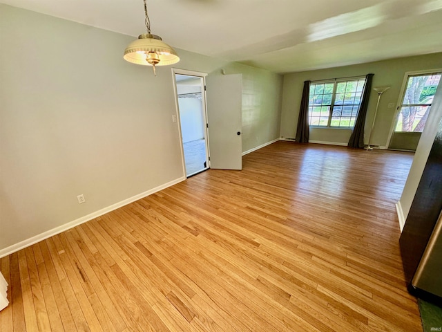 unfurnished room featuring light hardwood / wood-style floors