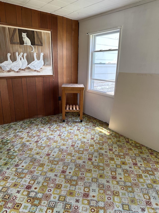 empty room featuring wooden walls