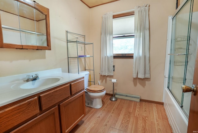 full bathroom featuring shower / bath combination with glass door, vanity, wood-type flooring, and toilet