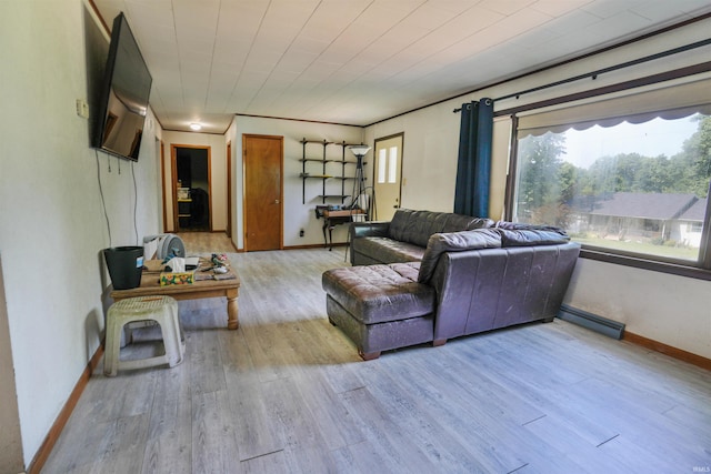 living area featuring visible vents, baseboards, and wood finished floors