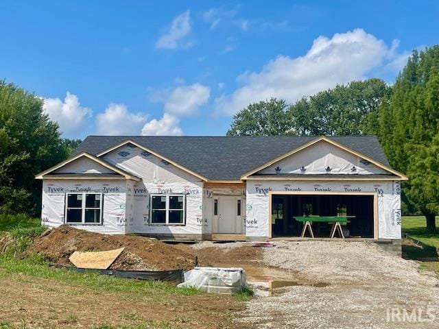 property in mid-construction with a garage