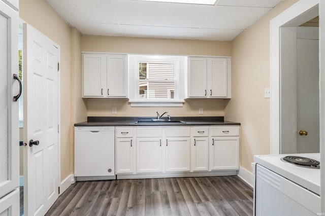 kitchen featuring sink, white cabinets, and white appliances