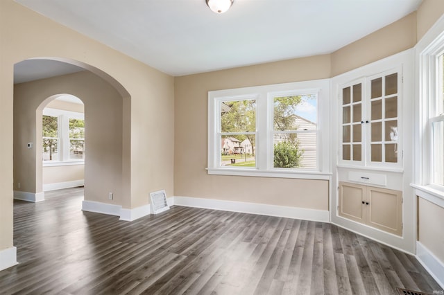 unfurnished room featuring dark hardwood / wood-style flooring