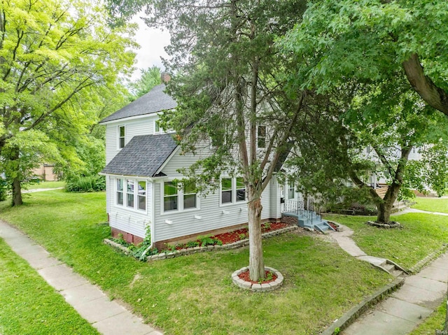 view of home's exterior with a yard