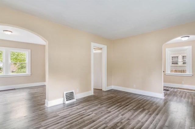 empty room featuring dark hardwood / wood-style floors