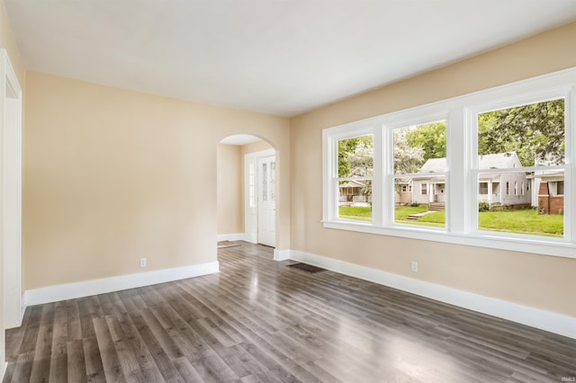 spare room with dark hardwood / wood-style floors