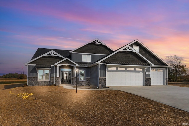 craftsman house with a garage