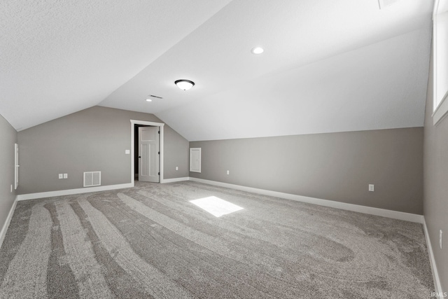 bonus room with visible vents, lofted ceiling, baseboards, recessed lighting, and carpet flooring