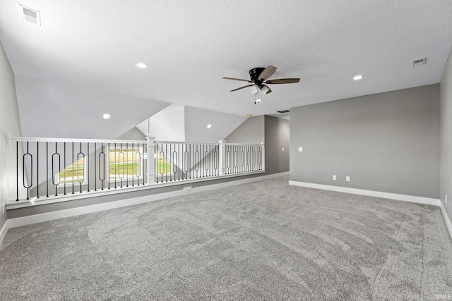 additional living space with baseboards, a ceiling fan, and visible vents