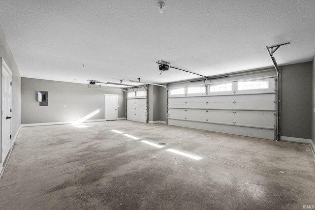 garage featuring a garage door opener and electric panel