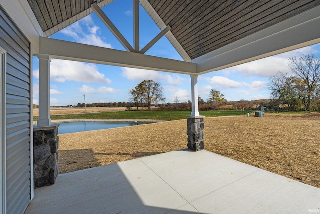 view of patio featuring a water view