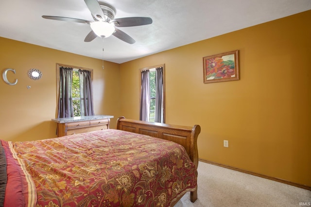 bedroom with light carpet and ceiling fan