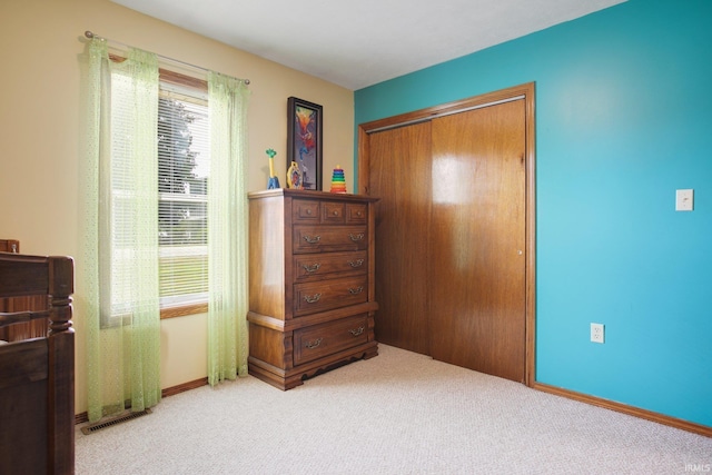 carpeted bedroom featuring a closet