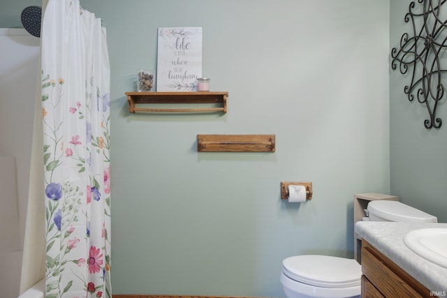 bathroom featuring vanity and toilet