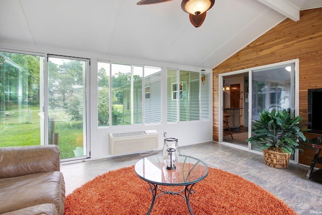 sunroom / solarium featuring ceiling fan, lofted ceiling with beams, and a wall mounted air conditioner