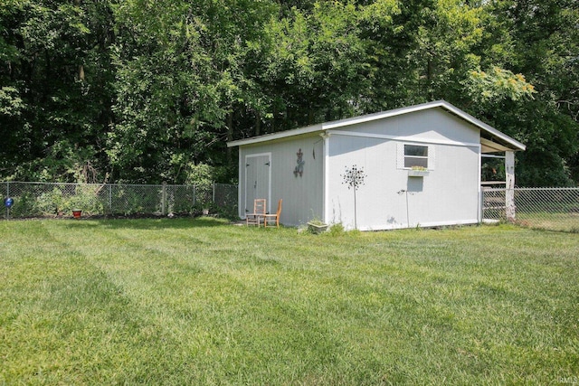 view of outbuilding featuring a lawn