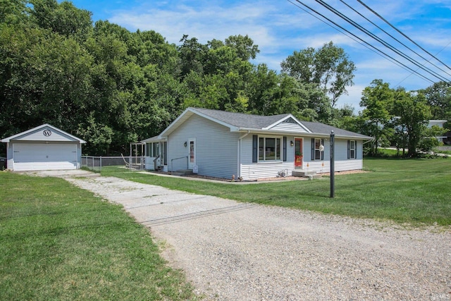 ranch-style house with a garage, an outbuilding, and a front lawn