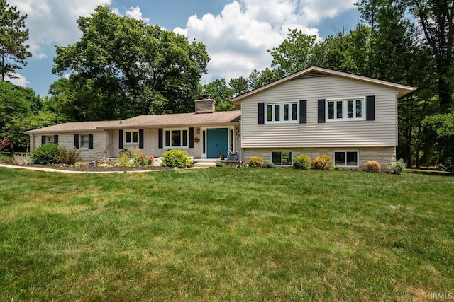 split level home with a front yard